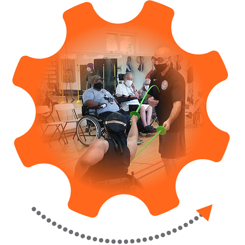 Bright orange gear graphic with an arrow denoting movement; photo inside the gear of a person fencing seated in a wheelchair against a person standing