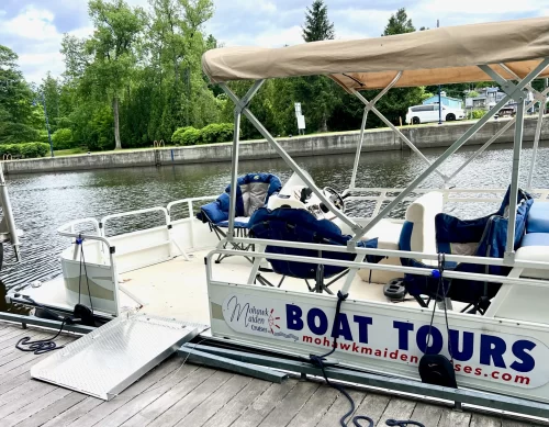 Mohawk Maiden Accessible -- pontoon ready for accessible excursions with a metal ramp that opens to lay across the divide from dock to boat.